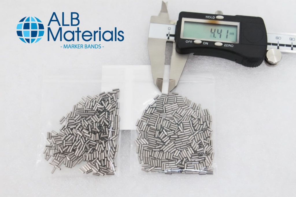 Close-up image of stent marker bands—small radiopaque components attached to the ends of a vascular stent to enhance visibility under X-ray or fluoroscopy during deployment and positioning in minimally invasive procedures.